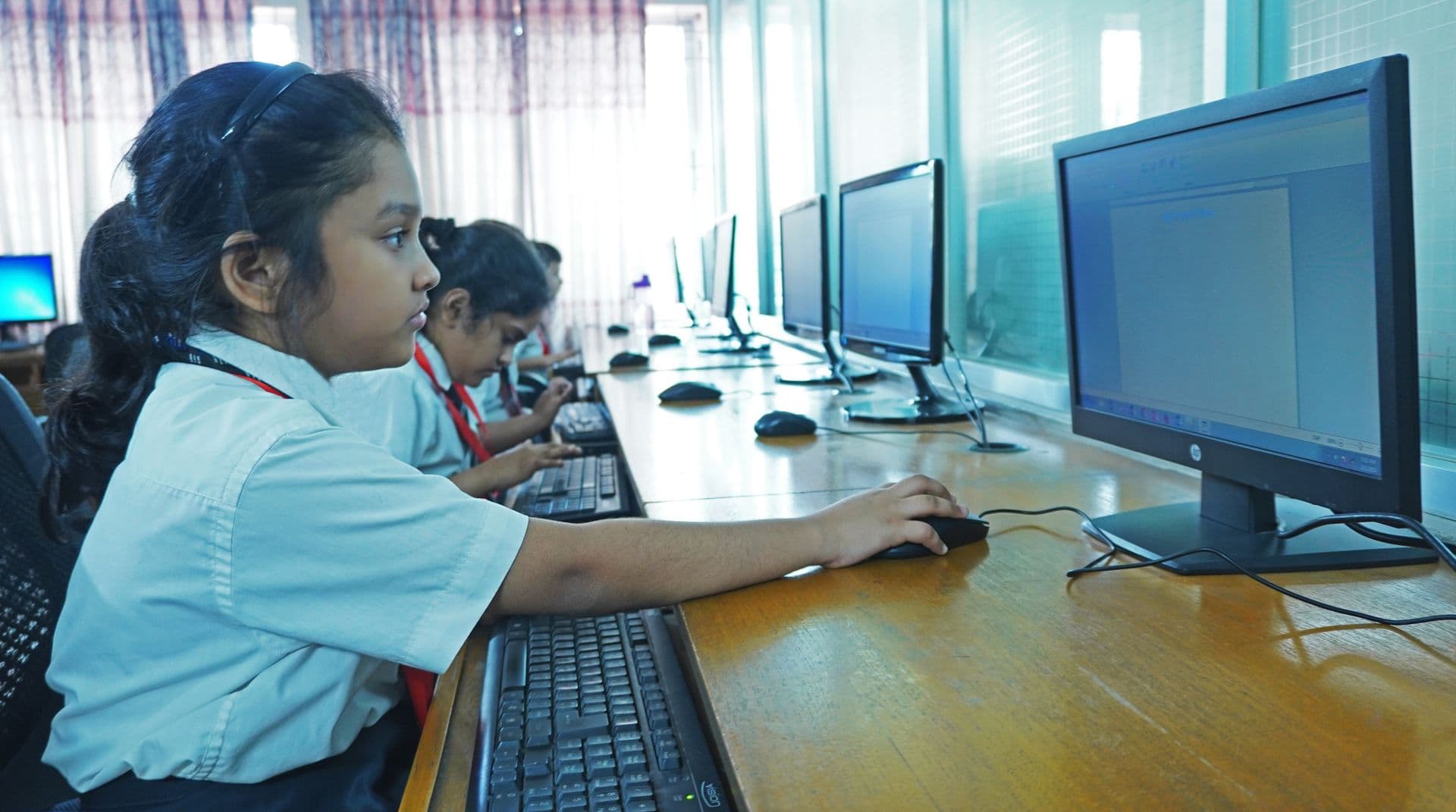 Students actively participating in a music class, playing various instruments