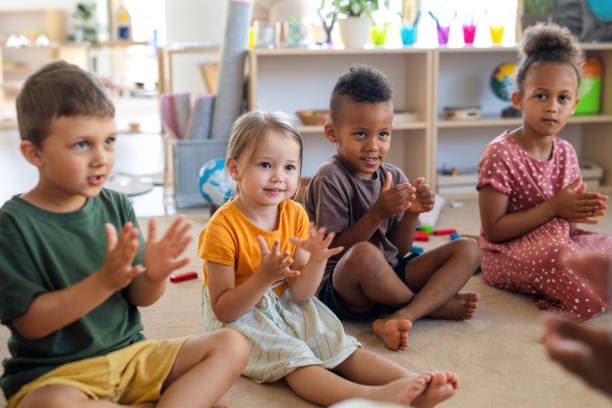 Students actively participating in a music class, playing various instruments