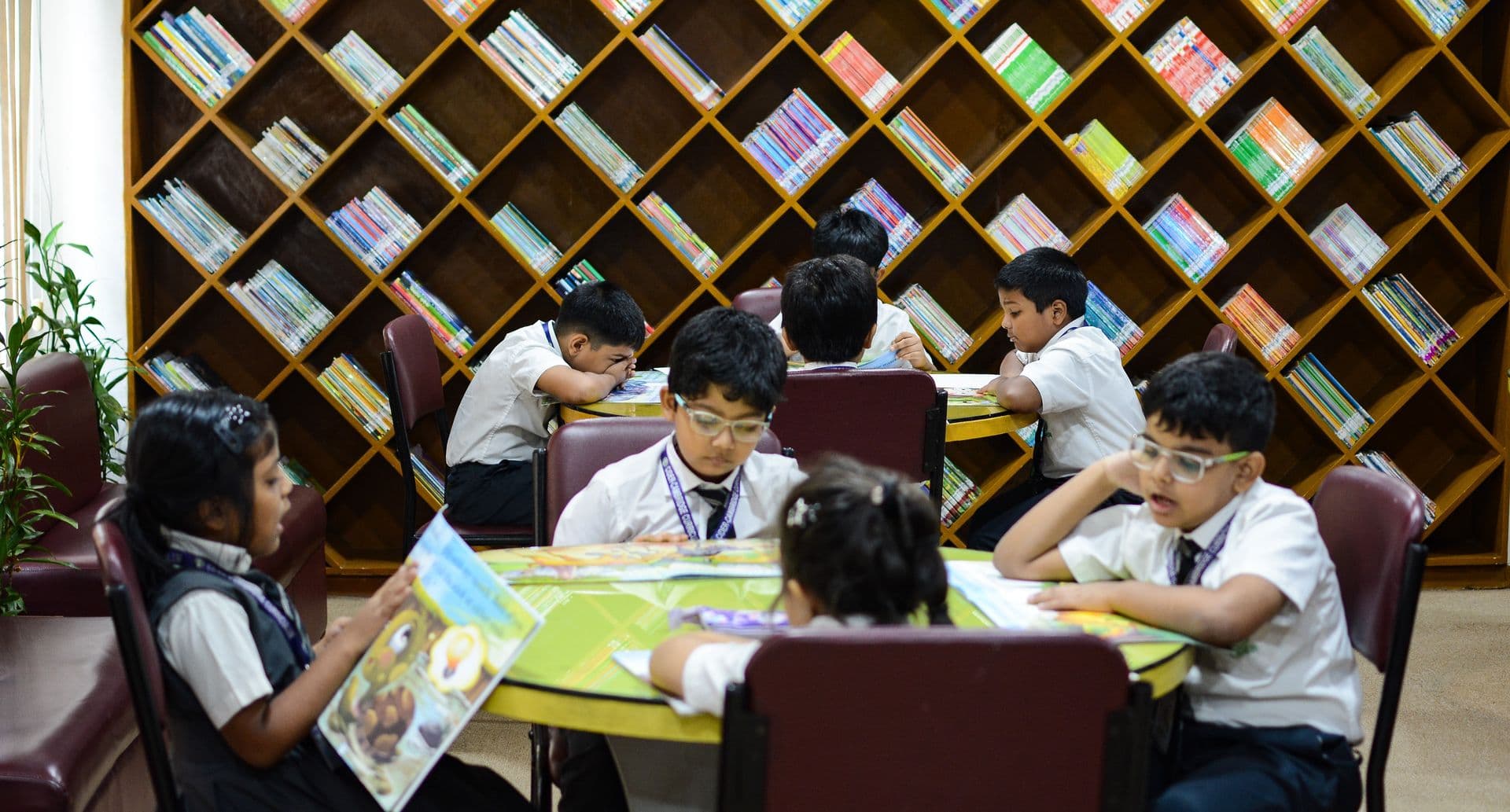 Students actively participating in a music class, playing various instruments