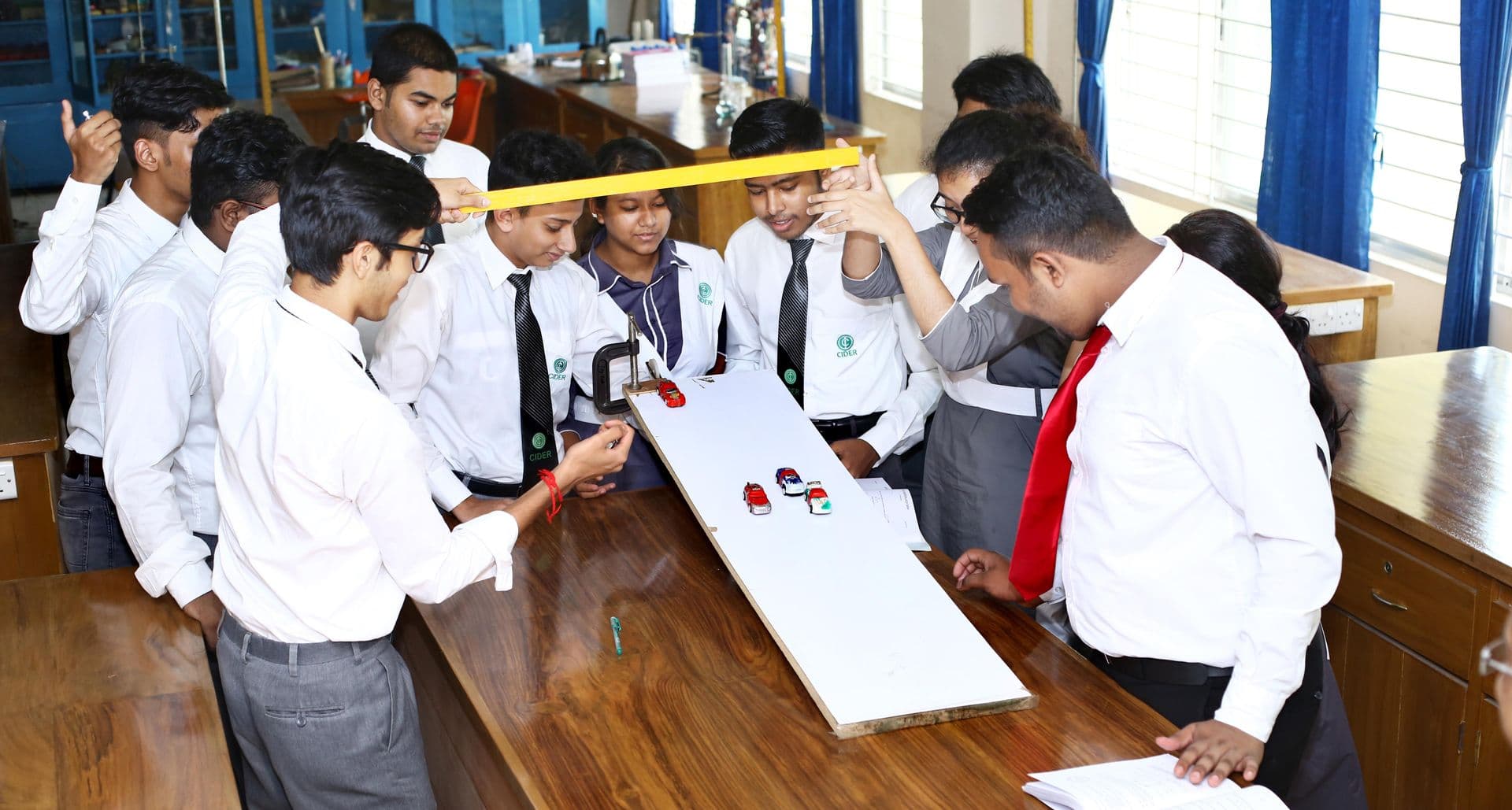 Students actively participating in a music class, playing various instruments