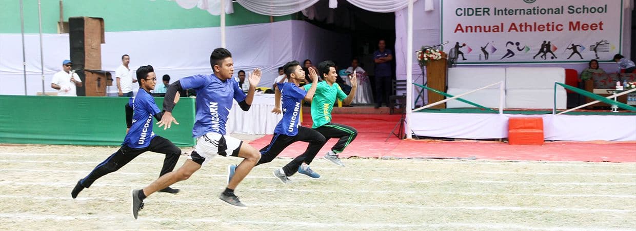 Students actively participating in a music class, playing various instruments